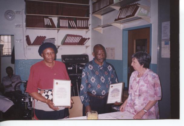 PHOTO Braille Service’s longest-serving couple - Mr Ruben and Ms Selina Radise. Both retired in 2000 – Reuben (Head-of-Department: Braille Printing) after 33 years and Selina (Print Proofreader) after 30 years of service! Ms Hazel Marshall, Blind SA president (1992-2004), handed over their Certificates of Appreciation.