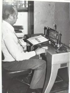 PHOTO Mr Antonie Zeelie, Braille Services manager from 1963-1996, embossing a braille master plate with the English-manufactured BEM No. 7 (Braille Embossing Machine). It was similar to the machines used by Pioneer Printers in Worcester at the time. Duplication was done on a French-manufactured Jurine platen, still in use today! These machines were imported by Evelyn Haddon from France in July 1964 at a cost of R4 000.