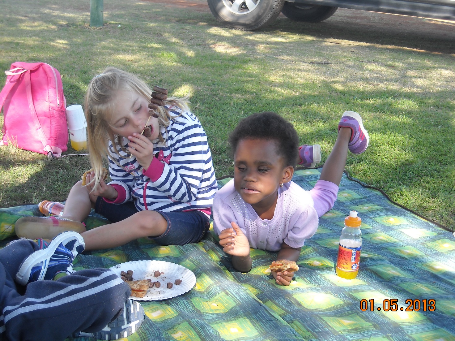 blind-children-on-a-picnic-one-lying-on-the-gras