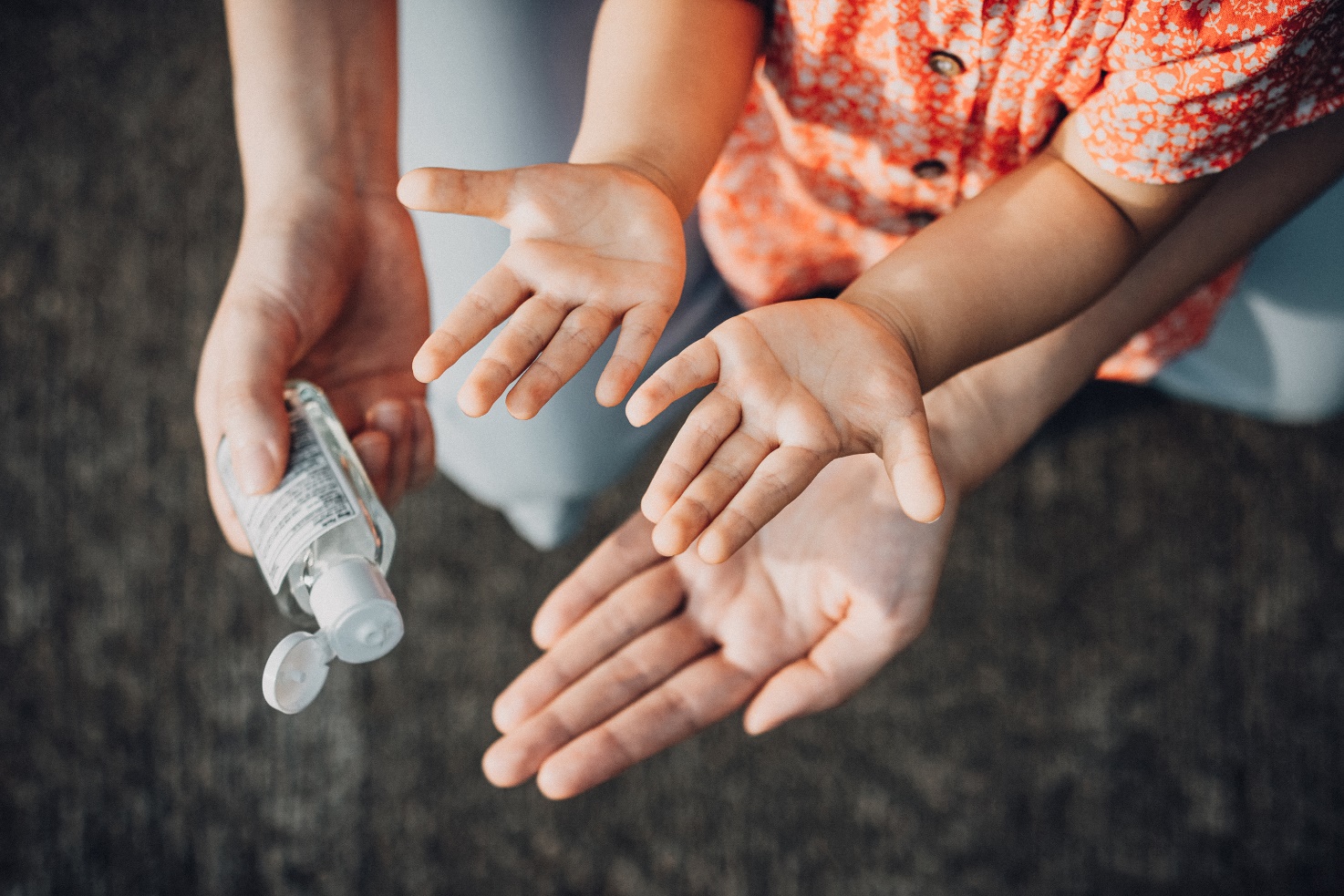 parent sanitizing childs hand