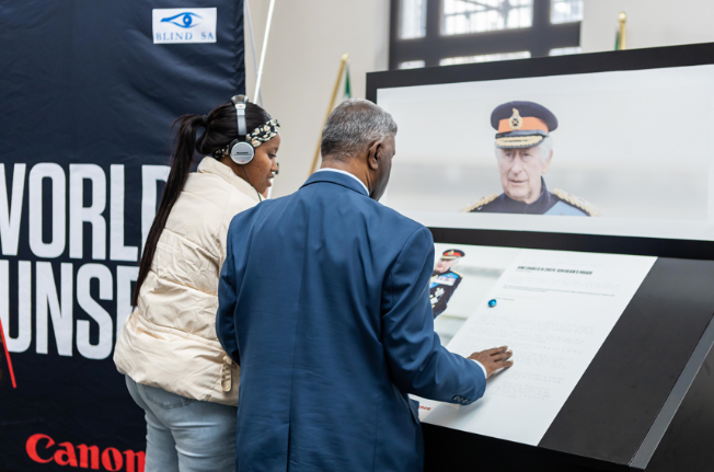 Image of Blind SA CEO & his PA at the exhibition.